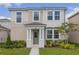 Charming two-story home featuring a covered front porch and well-maintained landscaping at 11944 Sunsail Ave, Orlando, FL 32832
