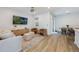 Inviting living room with neutral decor, a modern TV, and an adjacent dining area at 11944 Sunsail Ave, Orlando, FL 32832