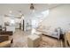 Open-concept living room, kitchen, and entryway with light wood floors and white walls at 11944 Sunsail Ave, Orlando, FL 32832