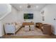 Cozy living room with a plush sofa, decorative rug, and ample seating arrangement at 11944 Sunsail Ave, Orlando, FL 32832