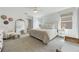 Bright bedroom featuring plush carpet, soft textures, and ample natural light from the large windows at 11944 Sunsail Ave, Orlando, FL 32832