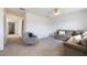 Open and airy upstairs living room with neutral tones, natural light, and comfortable seating at 11944 Sunsail Ave, Orlando, FL 32832