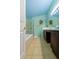 A bright bathroom with a tub, glass shower, and dark wood cabinetry at 131 Country Creek Ln, Kissimmee, FL 34746