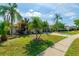 Beautiful single-Gathering home with meticulously kept lawn and mature tropical landscaping at 131 Country Creek Ln, Kissimmee, FL 34746