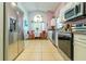 Modern kitchen featuring stainless steel appliances and adjacent breakfast nook at 131 Country Creek Ln, Kissimmee, FL 34746