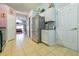 View of kitchen area, stainless steel refrigerator, and view of the living room at 131 Country Creek Ln, Kissimmee, FL 34746