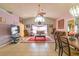 Open concept living room with high ceilings, tile floors, and comfortable seating arrangement at 131 Country Creek Ln, Kissimmee, FL 34746