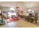 Bright living area with high ceilings, fan, neutral paint, and dining table with seating at 131 Country Creek Ln, Kissimmee, FL 34746