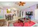 Bright living space with open layout, tile floors, and comfortable seating arrangement at 131 Country Creek Ln, Kissimmee, FL 34746