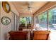Cozy enclosed patio with comfortable seating, perfect for relaxing and enjoying the outdoor view at 131 Country Creek Ln, Kissimmee, FL 34746