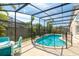 Enclosed pool area with a crystal-clear pool and ample seating, perfect for outdoor relaxation at 131 Country Creek Ln, Kissimmee, FL 34746