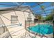 Backyard pool with screened enclosure and a safety fence for secure outdoor enjoyment at 131 Country Creek Ln, Kissimmee, FL 34746