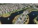 Aerial view showcasing a charming community with ponds, walking paths, and lush landscaping at 1340 Blue Stem Ln, Winter Park, FL 32792