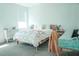 Bright bedroom featuring light walls, a wooden bed frame, and stylish decorations at 1340 Blue Stem Ln, Winter Park, FL 32792