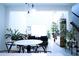 Open concept dining area with modern light fixtures and views of the living room at 1340 Blue Stem Ln, Winter Park, FL 32792