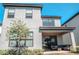 Two-story home with a covered patio area and well-maintained landscaping at 1340 Blue Stem Ln, Winter Park, FL 32792