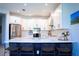 Open kitchen design with quartz countertops, stainless steel appliances, and bar seating at 1340 Blue Stem Ln, Winter Park, FL 32792