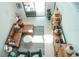 A modern living room with stylish sectional sofa, decorative shelving and beautiful plants at 1340 Blue Stem Ln, Winter Park, FL 32792