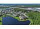 High angle aerial view showcases a community nestled between a lake and a highway at 13480 Applerose Ln # 19, Orlando, FL 32824