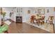 Dining area with a wooden table, six chairs, and a decorative rug at 13480 Applerose Ln # 19, Orlando, FL 32824