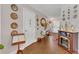 Hallway with tile floors, light walls, decorative plates, and an electric fireplace at 13480 Applerose Ln # 19, Orlando, FL 32824