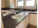 Bathroom vanity with double sinks and tile floor at 144 Costa Mesa Dr, Lady Lake, FL 32159