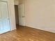 Bedroom with wood floor and neutral paint at 144 Costa Mesa Dr, Lady Lake, FL 32159
