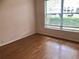 Comfortable bedroom featuring laminate flooring and a large window at 144 Costa Mesa Dr, Lady Lake, FL 32159