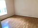 Bright bedroom featuring a window for natural light and laminate floors at 144 Costa Mesa Dr, Lady Lake, FL 32159