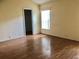 Bedroom with wood floor and neutral paint at 144 Costa Mesa Dr, Lady Lake, FL 32159