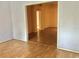 Hallway view showcasing hardwood flooring and neutral colored walls at 144 Costa Mesa Dr, Lady Lake, FL 32159
