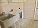 Laundry room with sink at 144 Costa Mesa Dr, Lady Lake, FL 32159
