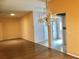Bright living room with wood floors, arched doorways, and a decorative chandelier at 144 Costa Mesa Dr, Lady Lake, FL 32159