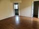 Open floor plan living room with wood floors at 144 Costa Mesa Dr, Lady Lake, FL 32159