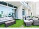 Expansive balcony offering ample seating, faux grass, and open views, perfect for entertaining and relaxation at 150 E Robinson St # 626, Orlando, FL 32801