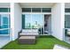 Cozy balcony featuring comfortable seating and artificial turf, perfect for enjoying the outdoor ambiance with city views at 150 E Robinson St # 626, Orlando, FL 32801