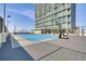 Rooftop basketball and volleyball court for recreational enjoyment against the backdrop of a high-rise building at 150 E Robinson St # 626, Orlando, FL 32801
