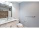 Bathroom with a modern vanity, and shower with tile at 150 E Robinson St # 626, Orlando, FL 32801