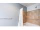 Bathroom with a shower/tub combination featuring tile and modern fixtures at 150 E Robinson St # 626, Orlando, FL 32801