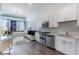 Living area and kitchen with stainless steel appliances and modern design at 150 E Robinson St # 626, Orlando, FL 32801