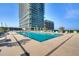 Inviting outdoor pool surrounded by lounge chairs, offering a refreshing escape with a modern building backdrop at 150 E Robinson St # 626, Orlando, FL 32801