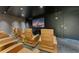 Private theater room with comfortable seating and a large screen, providing an immersive entertainment experience at 150 E Robinson St # 626, Orlando, FL 32801