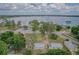 Aerial view showcases a home near a lake, offering scenic views and recreational opportunities at 1505 W Lake Cannon Nw Dr, Winter Haven, FL 33881