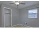 Bedroom featuring a closet, neutral paint, a ceiling fan, and a window at 1505 W Lake Cannon Nw Dr, Winter Haven, FL 33881