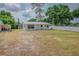 Well-maintained single-story home with white picket fence, providing privacy and curb appeal at 1505 W Lake Cannon Nw Dr, Winter Haven, FL 33881