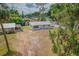 Charming single-story home with a white picket fence, offering a sense of privacy and security at 1505 W Lake Cannon Nw Dr, Winter Haven, FL 33881