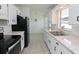 Bright kitchen features modern appliances, ample counter space, and stylish countertops and hardware at 1505 W Lake Cannon Nw Dr, Winter Haven, FL 33881