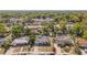 High-angle shot displays the residence, green trees and a clear blue sky in the surrounding neighborhood at 1508 Roger Babson Rd, Orlando, FL 32808