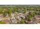 Spacious neighborhood from above features lots of trees and a lake in the background at 1508 Roger Babson Rd, Orlando, FL 32808