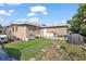 The backyard of this home is partially grass and features a patio set and grill at 1508 Roger Babson Rd, Orlando, FL 32808